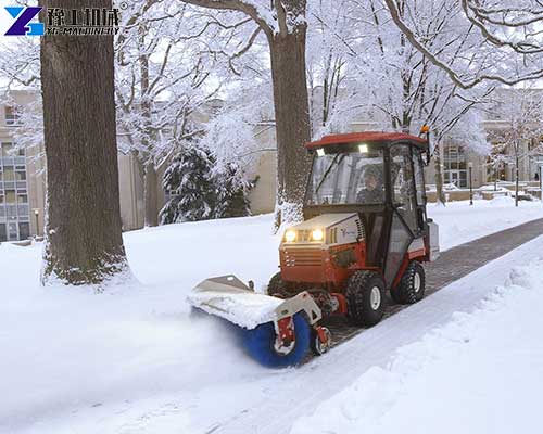 sidewalk snow sweeper working