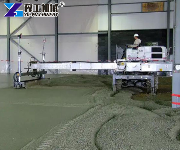 Laser screed leveling fresh concrete in construction site