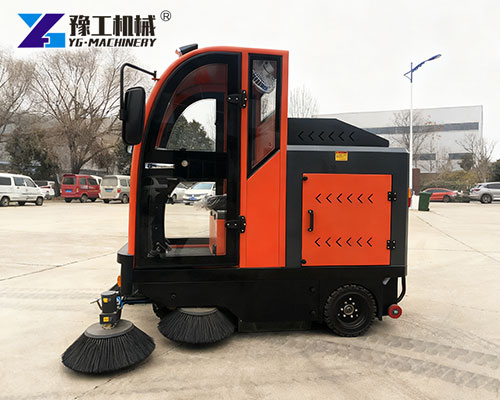 Factory floor cleaning machine removing dust