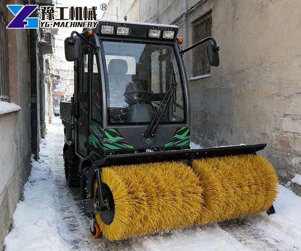 compact snow plow clearing narrow streets