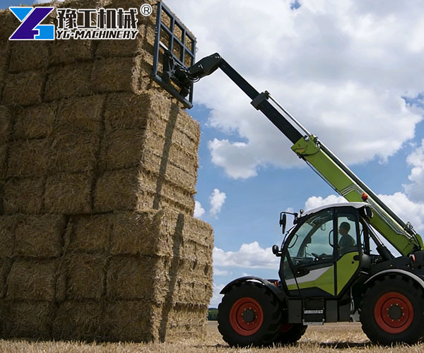 agricultural telehandler moving hay bales