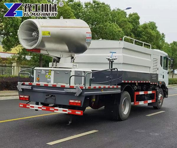 Mobile dust suppression truck spraying the road